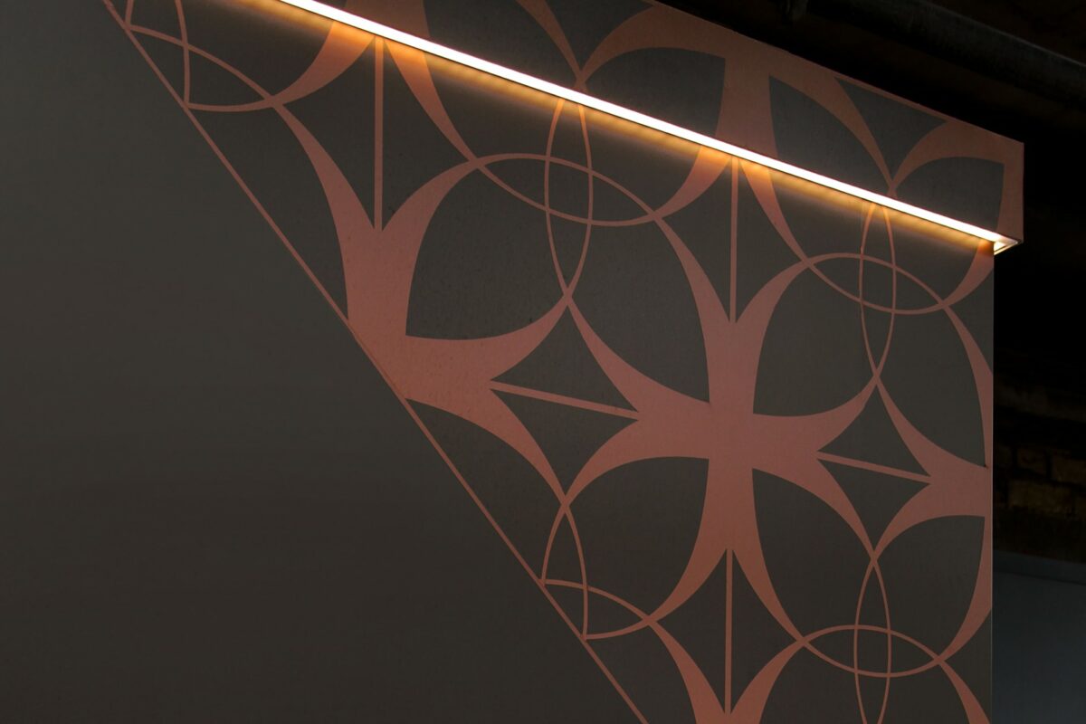 Hidden LED hoarding trim with bespoke metallic vinyl overlay