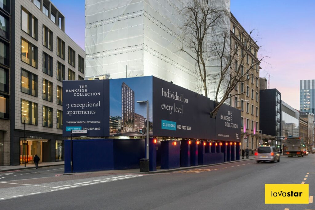 Graphic scaffolding wrap covering a site gantry promoting a new development