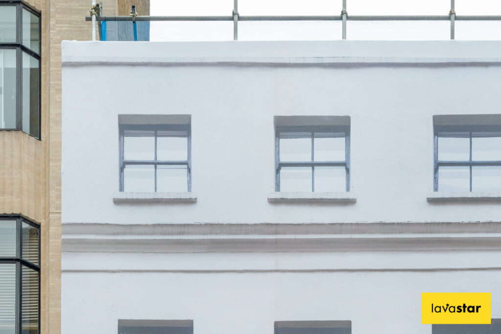 Photo of building printed on scaffolding