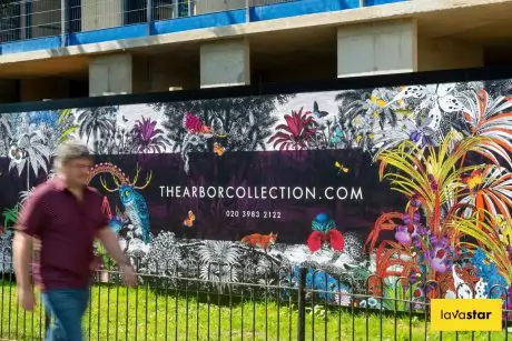 Colourful site hoarding signage featuring illustrative design