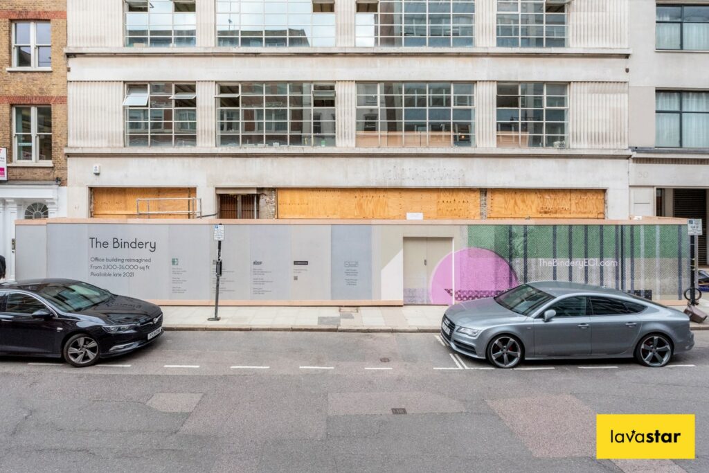 Printed wood hoarding in urban London area