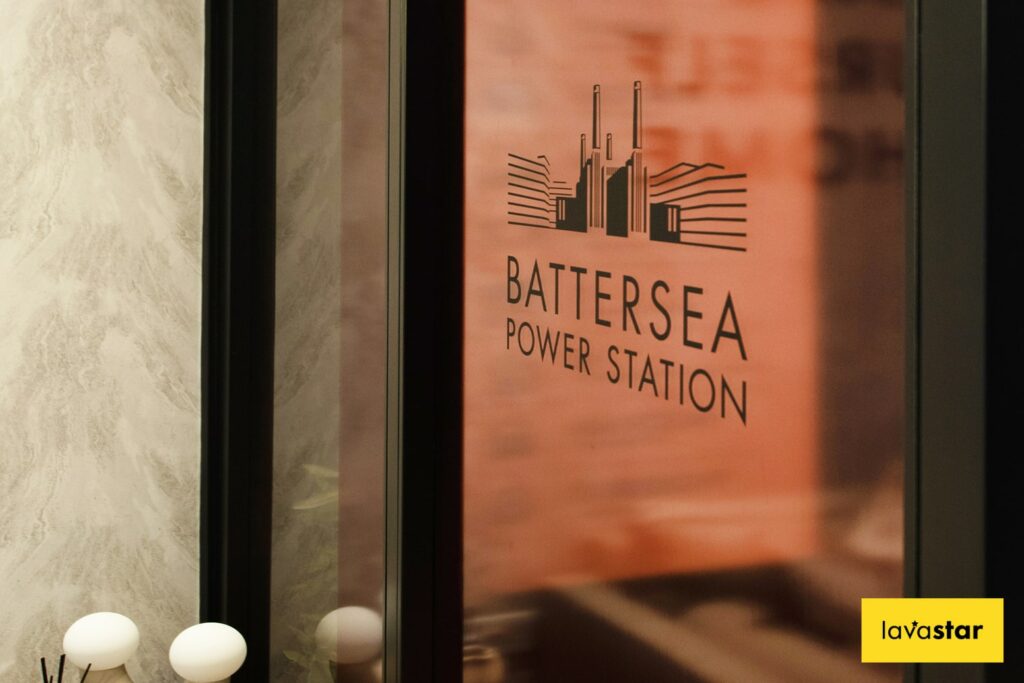 Printed vinyl window manifestation on optically clear with cut black vinyl logo