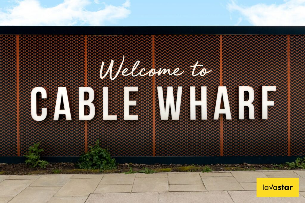 Welcome to Cable Wharf sign on a wall