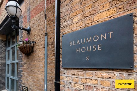 Etched slate navigational plaque for tenant signage at an office