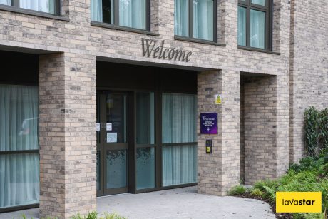 Cut lettering signage fixed to building facade at care home