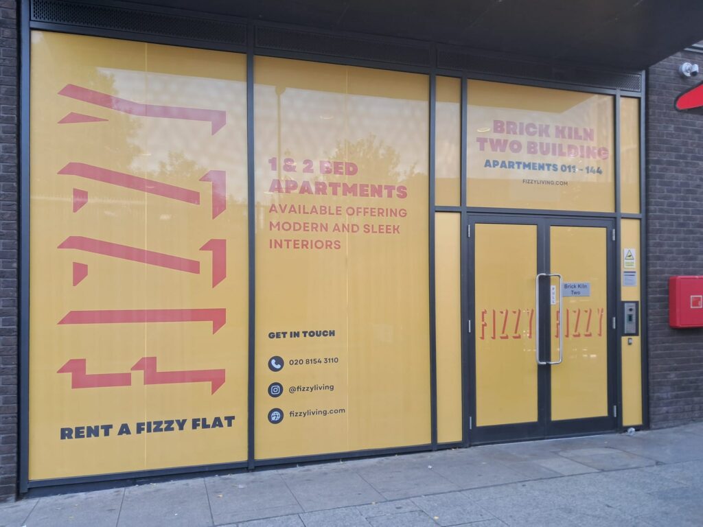 One way vision perforated window vinyl applied to glass facade