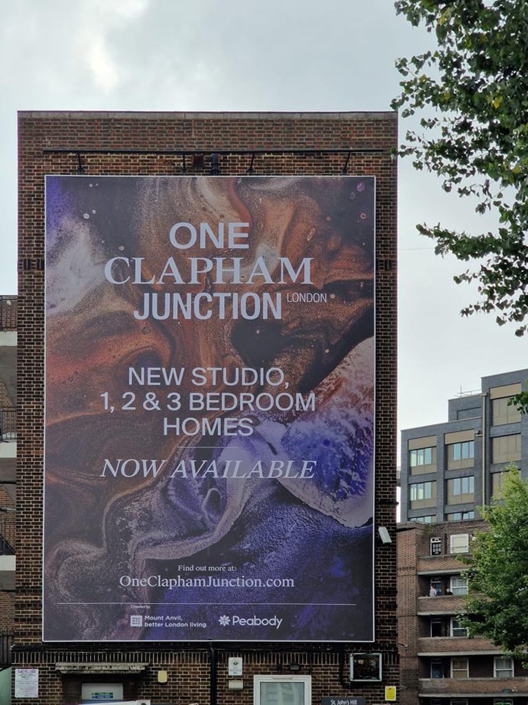 Tensioned PVC banner skin installed onto the side of a facade in Central London