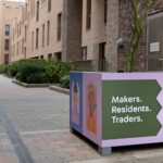 Printed wrap installed over a planter within a new housing development