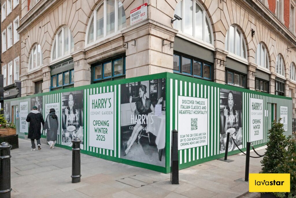 Printed hoarding boards on a construction site in London while retail unit is refurbished