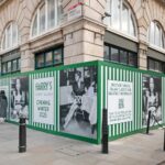 Printed hoarding boards on a construction site in London while retail unit is refurbished