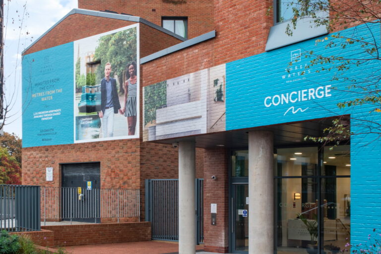 Printed brick wrap vinyl applied to facade to promote a new housing scheme