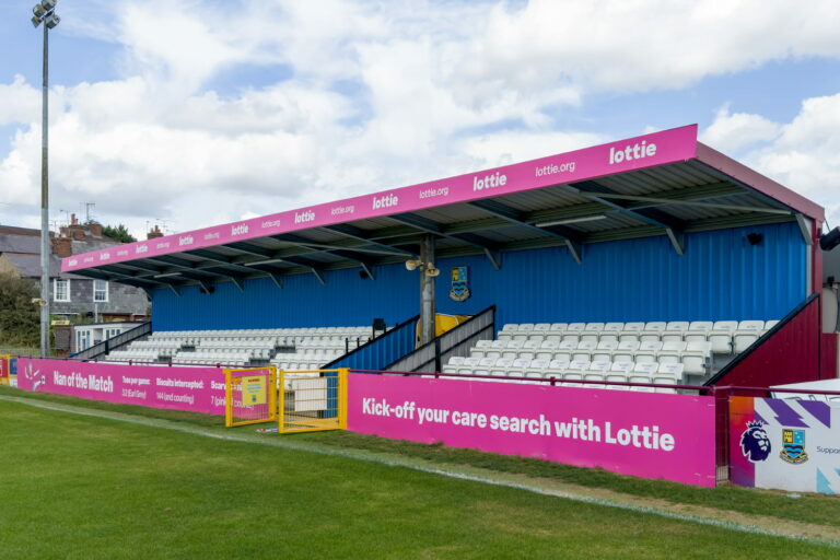 Printed dibond boards installed on a football stadium stand to advertise a sponsor