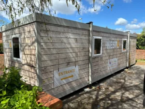 Vinyl facade wrap to modular cabin